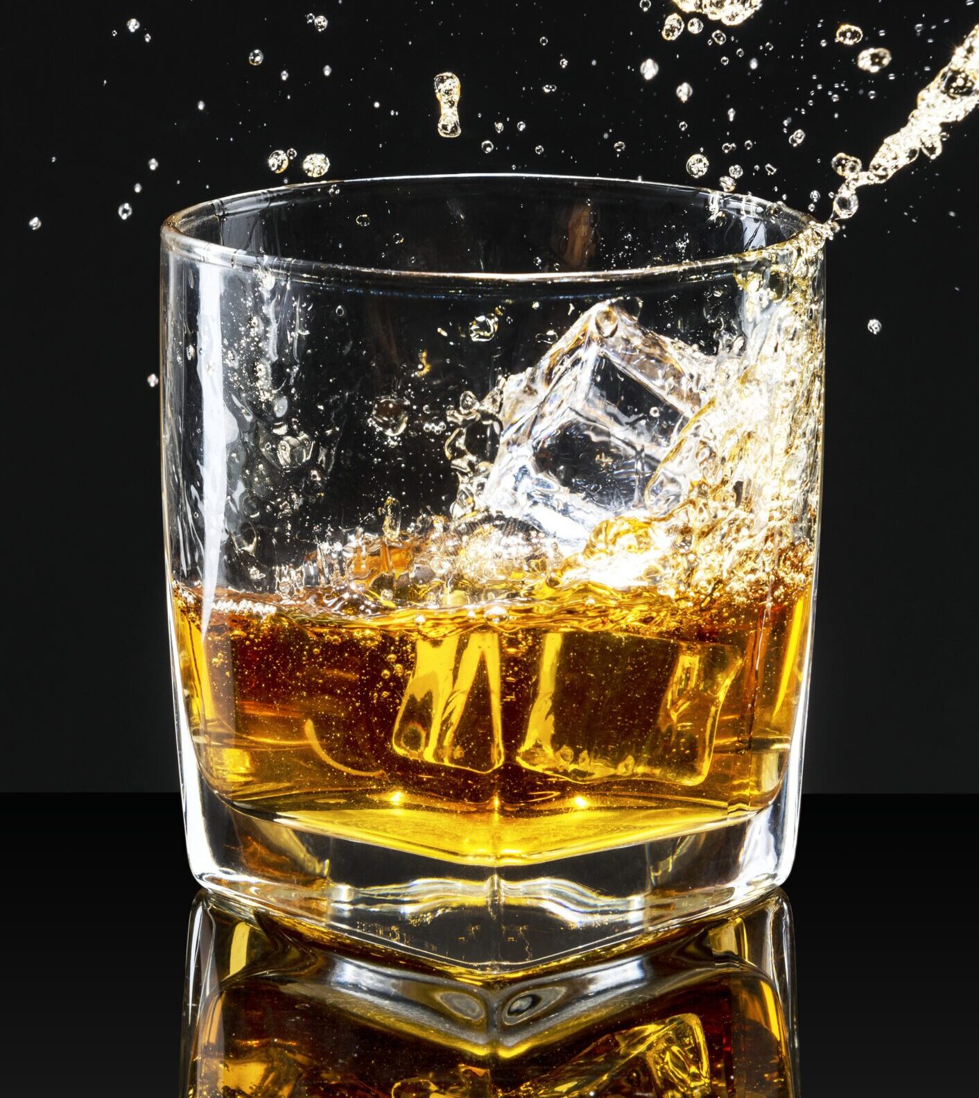 Whiskey on the rocks black background
